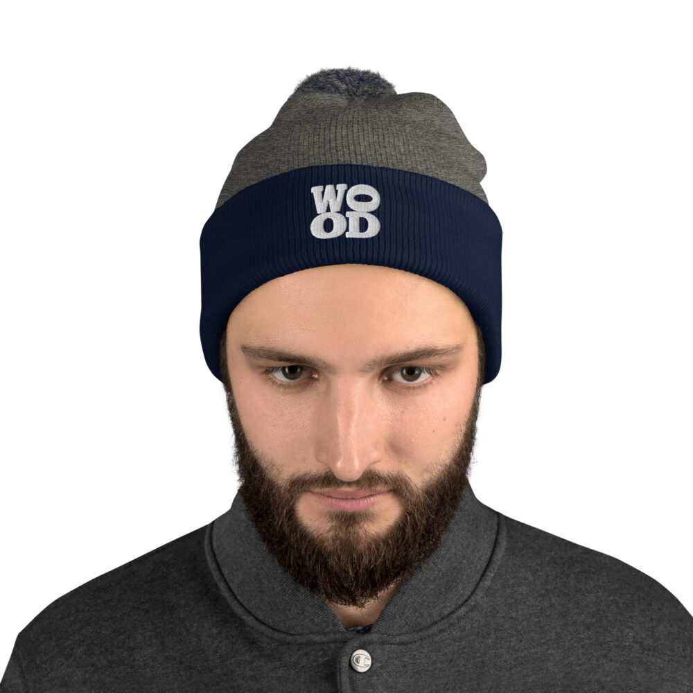 Model wearing Wood Morning Coffee Cabin Pom Pom Toque