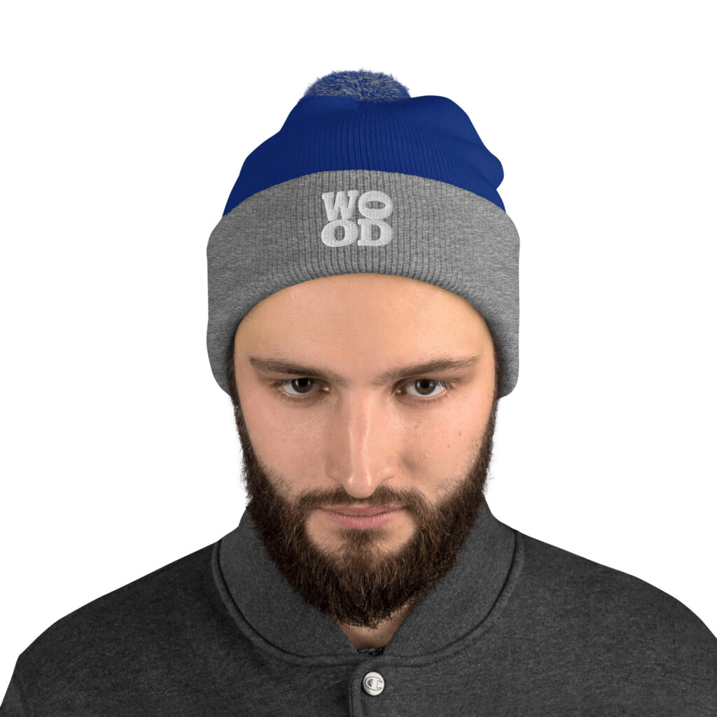 Model wearing Wood Morning Coffee Cabin Pom Pom Toque